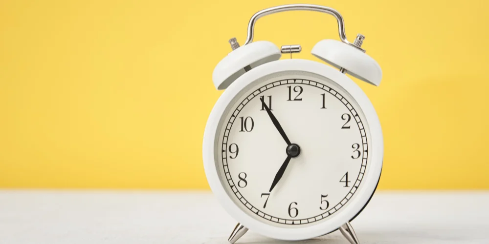 ESL lesson on vocabulary and grammar for daily routines and time expressions.